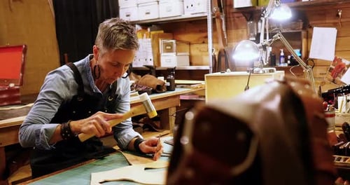 Woman Handcrafting Leather in Workshop