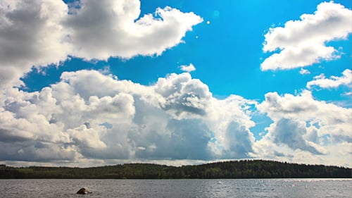 White Clouds Over Lake
