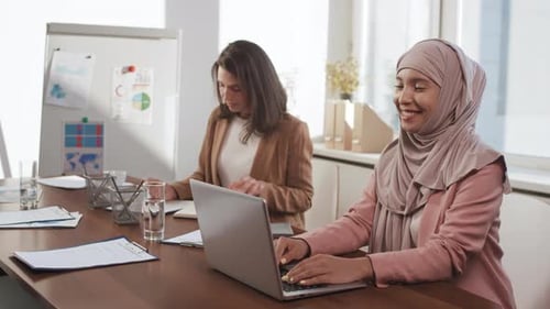 Young Women Working in Office