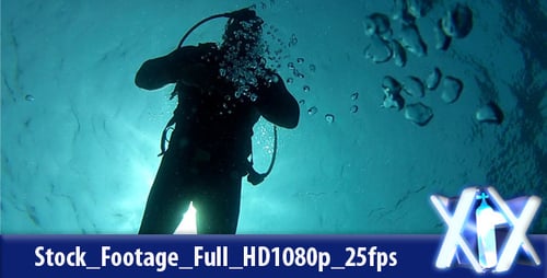 Silhouette of Scuba Diver Swimming Underwater in Ocean
