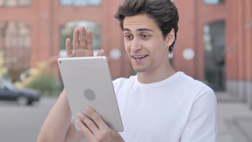 Outdoor Man Doing Video Chat Using Tablet