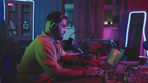 Man Playing Video Game and Live-Streaming