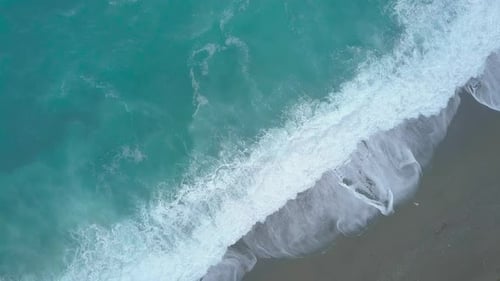Aerial Top Down View of Turquoise Sea Waves Foaming and Splashing, Big Waves From Above Rolling
