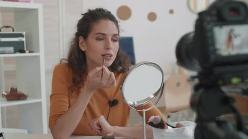 Woman Records Makeup Tutorial in Home Studio