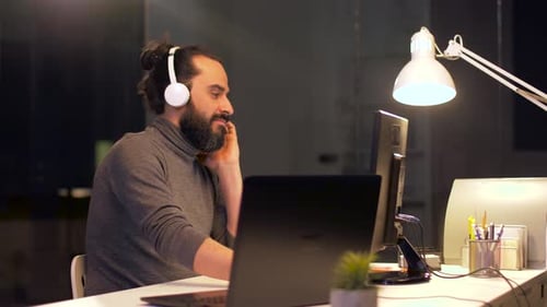 Man in Headphones Working with Computers at Office 31
