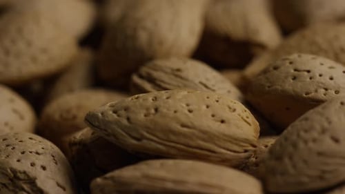 Cinematic, rotating shot of almonds on a white surface - ALMONDS 162
