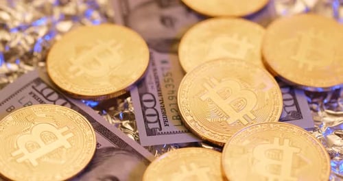 Golden Bitcoin Coins on US Dollar Bills