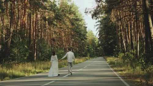 Hipster Couple in Love Walk in Beautiful Place Hold Hands Man and Woman Hugging and Enjoying