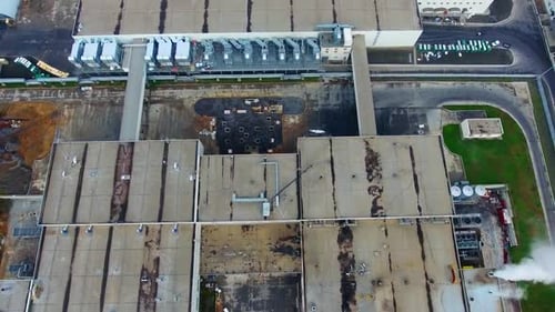 Modern manufacture in the countryside. Newly built factory from above. Big industrial zone.