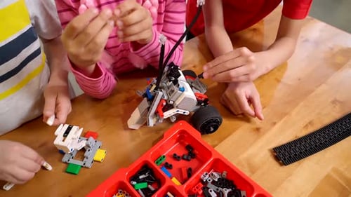 Creative Kids Using Building Kit.