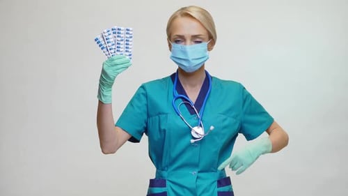 Woman in Medical Mask with Blister Pack Pills