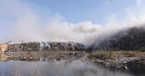 Polluted Landfill Emitting Smoke, Impacting Environment