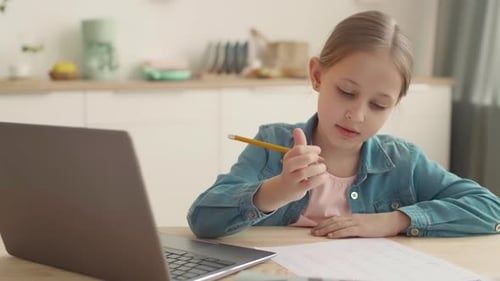 Schoolgirl Having Math Test at Home
