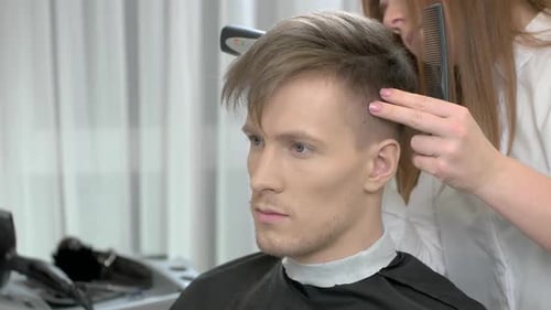 Man Getting Haircut in Salon