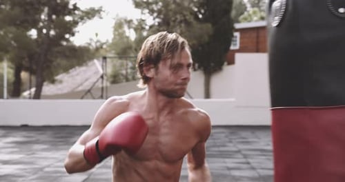 Athletic Man Boxing Outdoors
