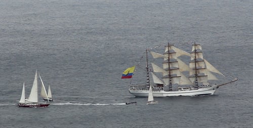 Sailing Vessel Glides Across the Calm Blue Ocean