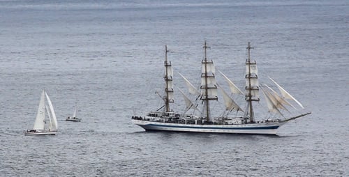 Tall Ship Sailing on the Ocean on a Cloudy Day