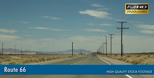Driving Through Desert Landscape with Distant Mountains
