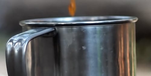 Tea Pouring Into A Mug