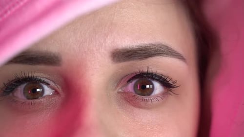 Portrait of Young Woman in Hood Looking at Camera