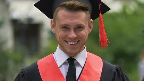Smiling Face of Male University Graduate Looking to Camera, Successful Student