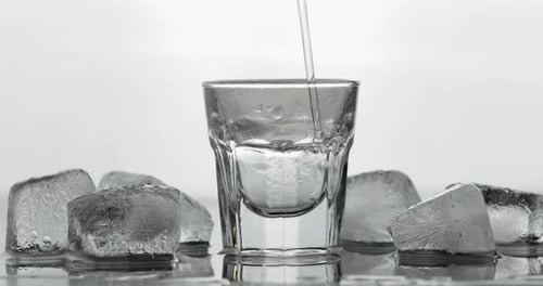 Icy Shot Glass Filled With Clear Liquid