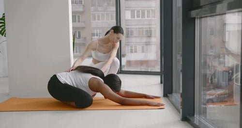 Multi Racial Girls Doing Yoga in Fitness Studio