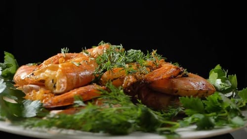 Close-up of Grilled Shrimp Garnished with Fresh Herbs