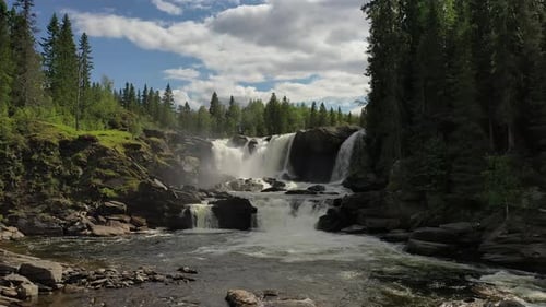 Scenic Waterfall Cascading Through Rocky Forest Landscape