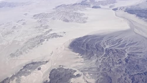 Flying over the desert in Southern California viewed from airplane