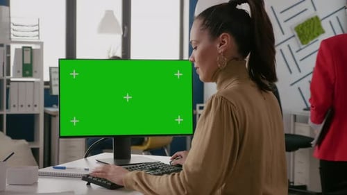 Business Woman Using Monitor with Green Screen