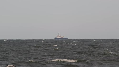 Fishing trawler on the horizon