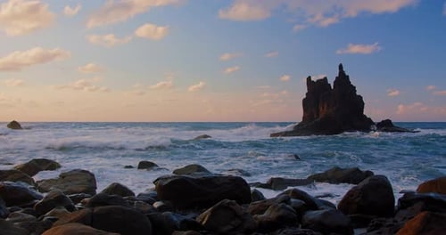 Sunset Sea Beach Volcanic Rocks in Ocean Waters