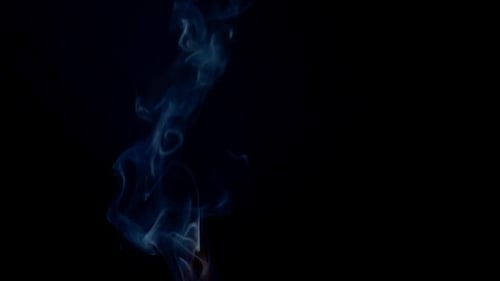 Wispy Blue Smoke Rising on Black Background