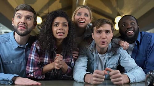 Excited Friends Watch Sporting Event Together