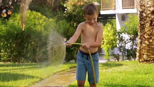 - Child Watering Lawn with Hose