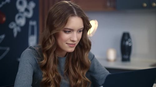 Portrait of Smiling Businesswoman Working Laptop Computer at Remote Workplace.
