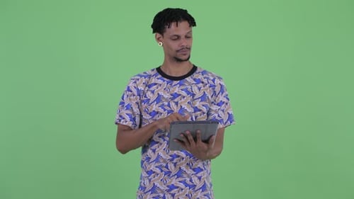 Man Using Tablet and Giving Thumbs Up