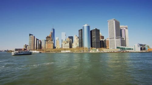 Boat sailing by the Lower Manhattan in New York
