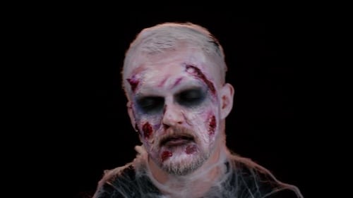 Man With Zombie Makeup Stares Frighteningly At Camera