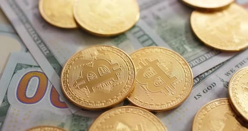 Bitcoin Cryptocurrency Coins on US Dollar Bills