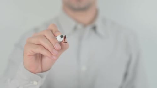 Man Writes the Word Import on Clear Surface