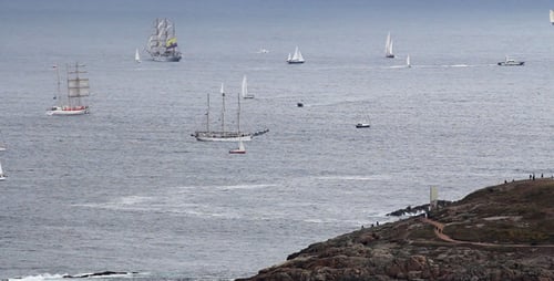 Tall Ships and Sailboats on Overcast Day