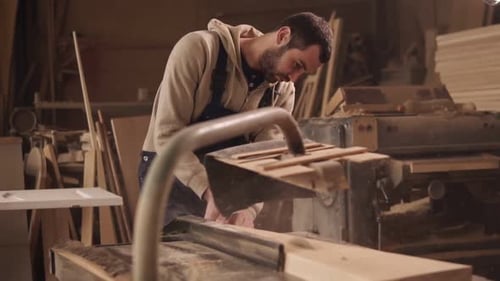 The Craftman is Working on Electric Saw Machine