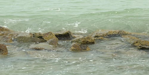 Waves Crashing on Rocky Beach Shoreline