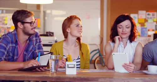 Adults Collaborate at Modern Workplace Business Meeting