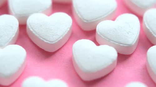 Close Up of White Heart Candy Pills