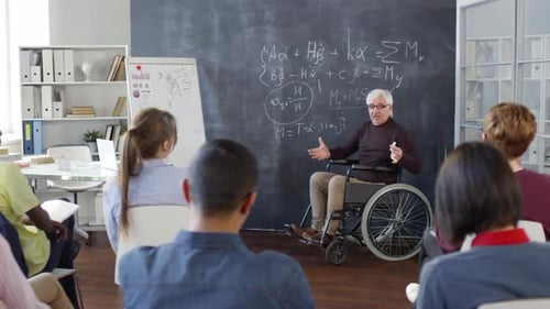 Classroom Lecture with Gray Haired Teacher in Wheelchair