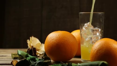 Pouring Fresh Orange Juice into a Glass