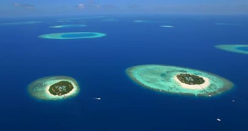 Aerial drone view of scenic tropical islands in the Maldives.